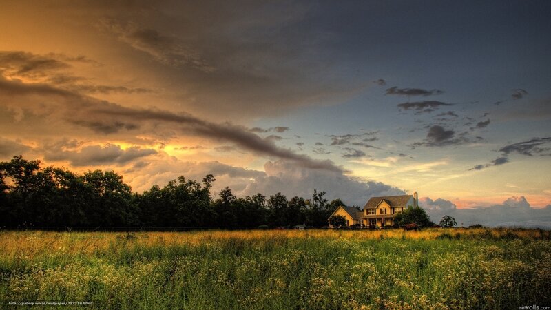 House at sunset in a field