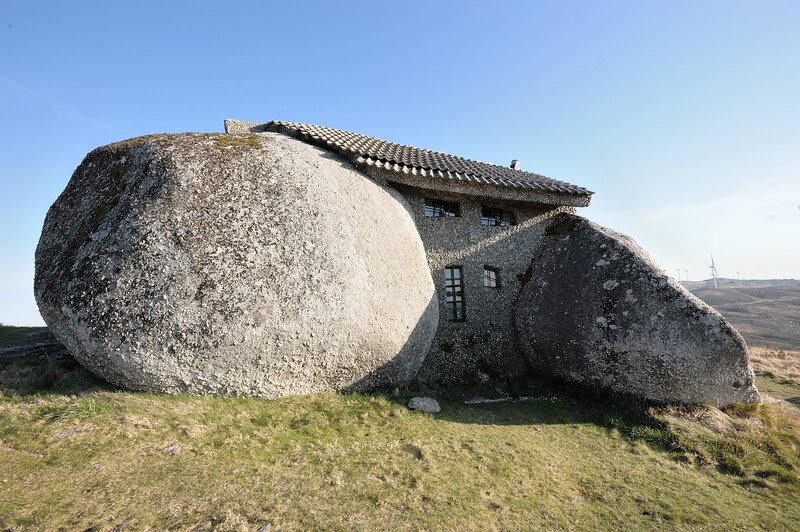 House built into a large boulder