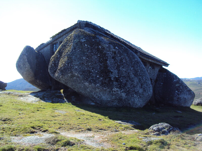 House built into a large boulder