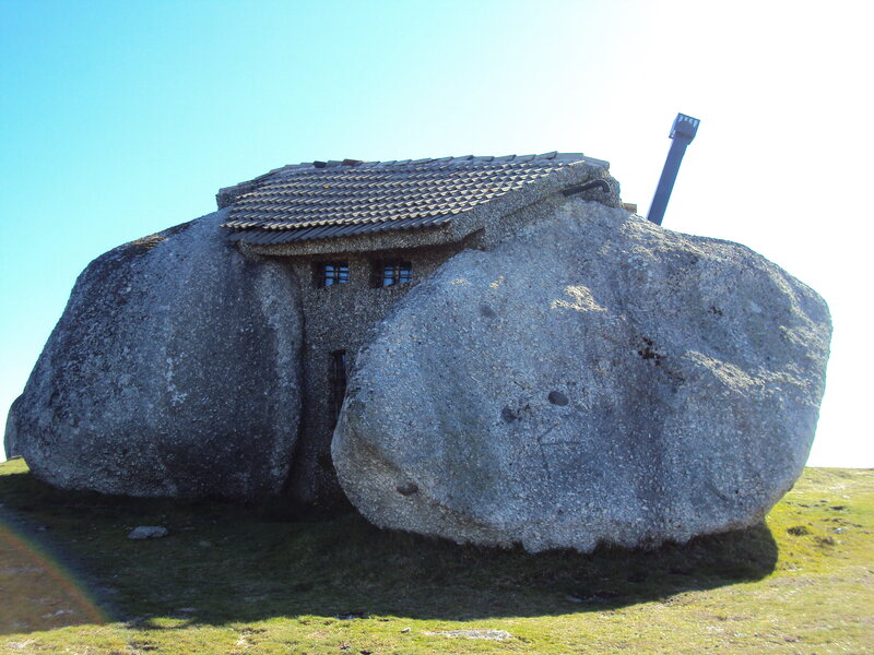 House built into a large rock