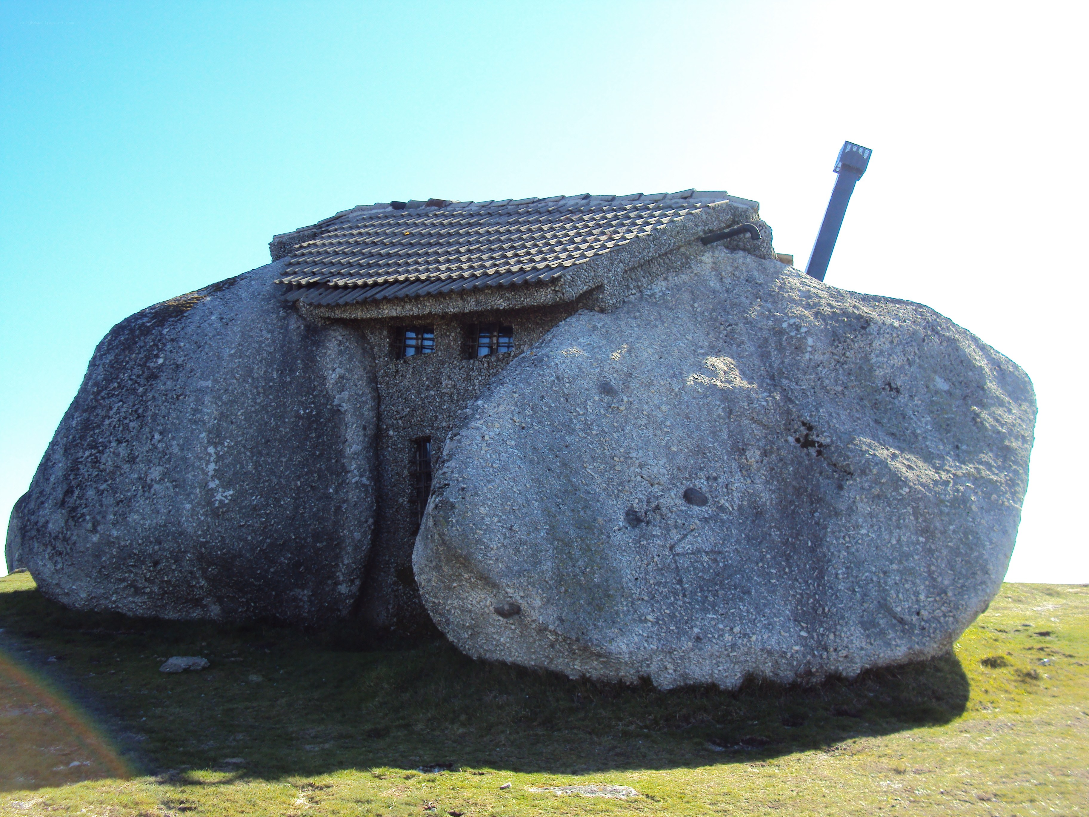 House built into a large rock
