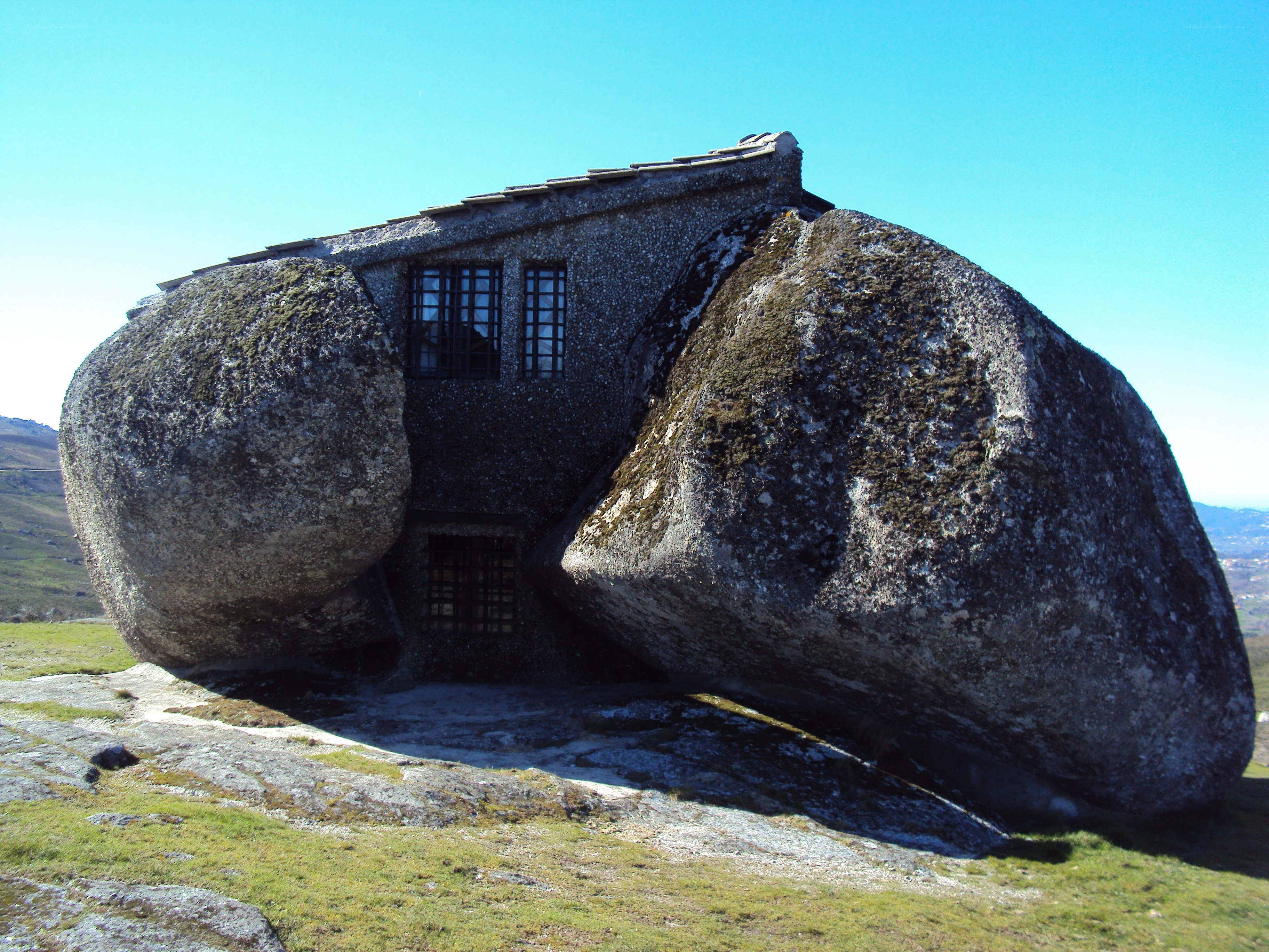 House built into large boulders
