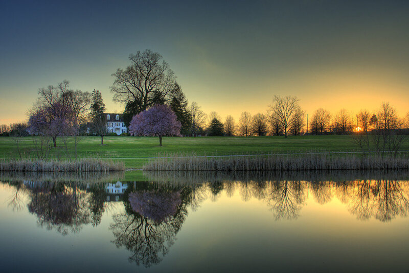 House by Lake at Sunset