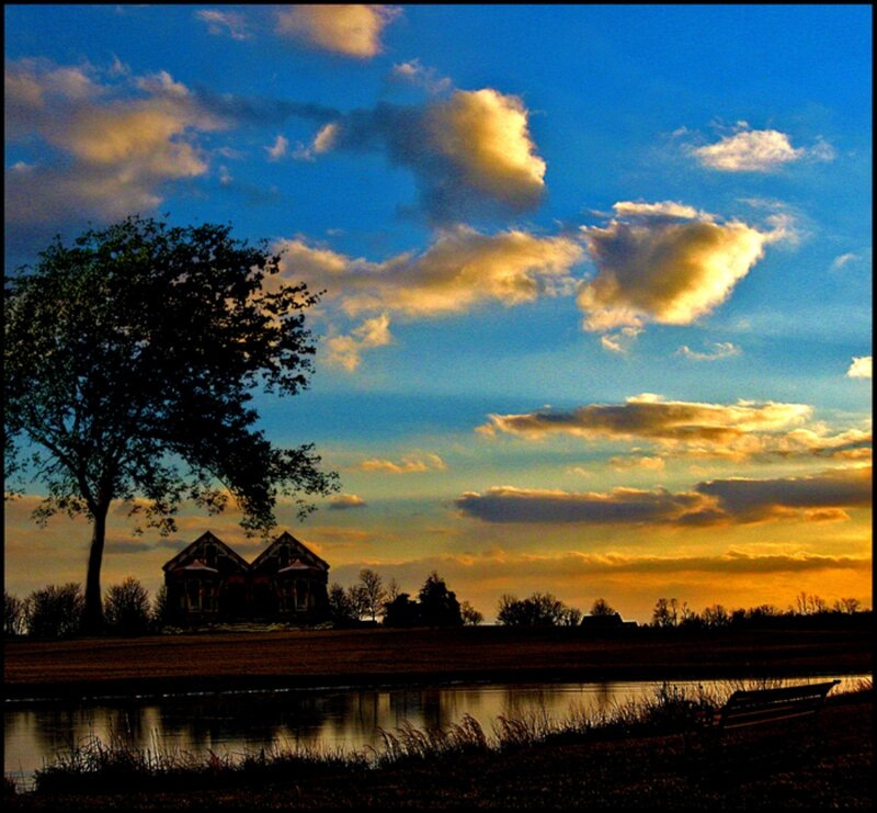 House by Pond at Sunset