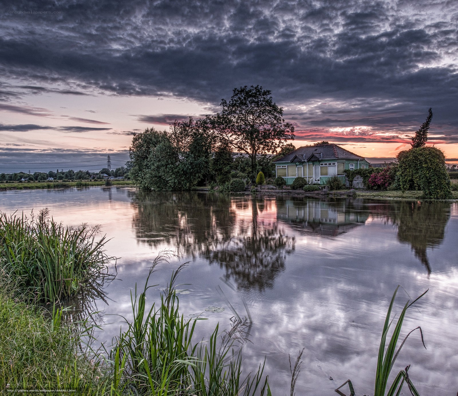 House by the lake at sunset