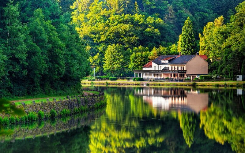 House by the river at sunset