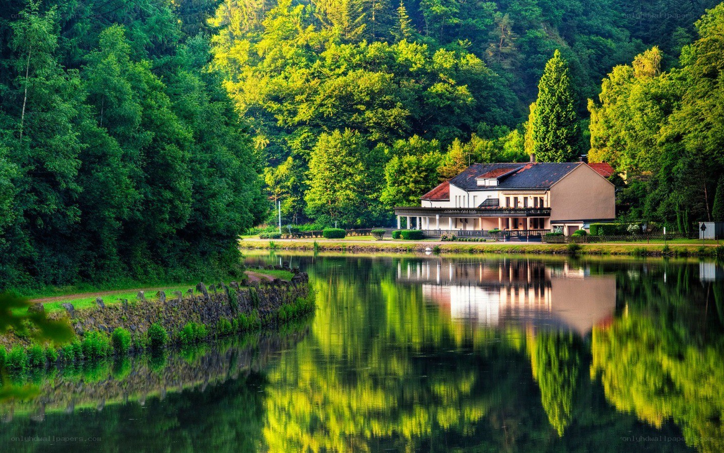 House by the river at sunset