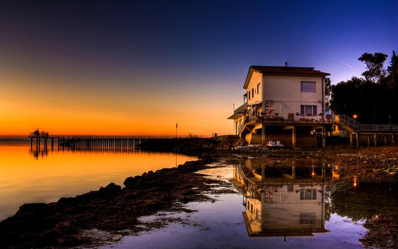House by the sea at sunset