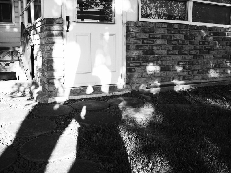 House entrance with stone path
