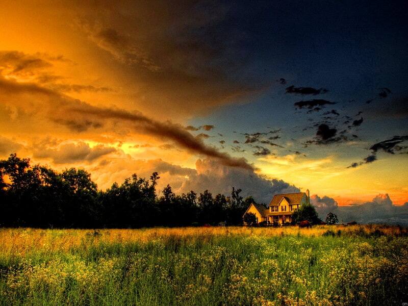 House in Field at Sunset