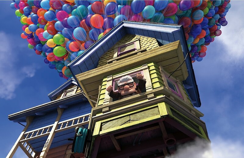 house lifted by balloons