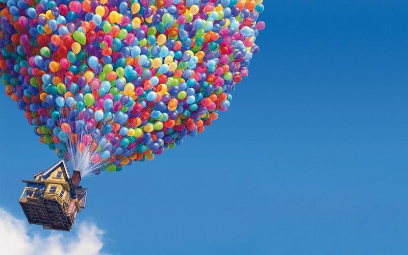 house lifted by balloons