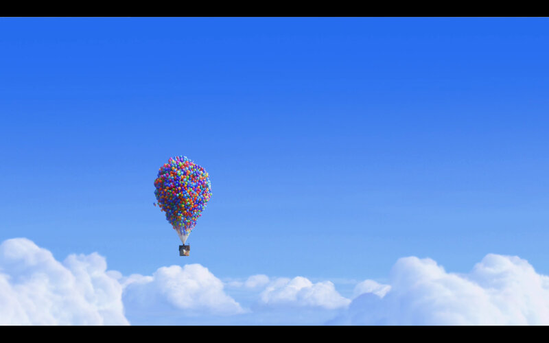 house lifted by balloons