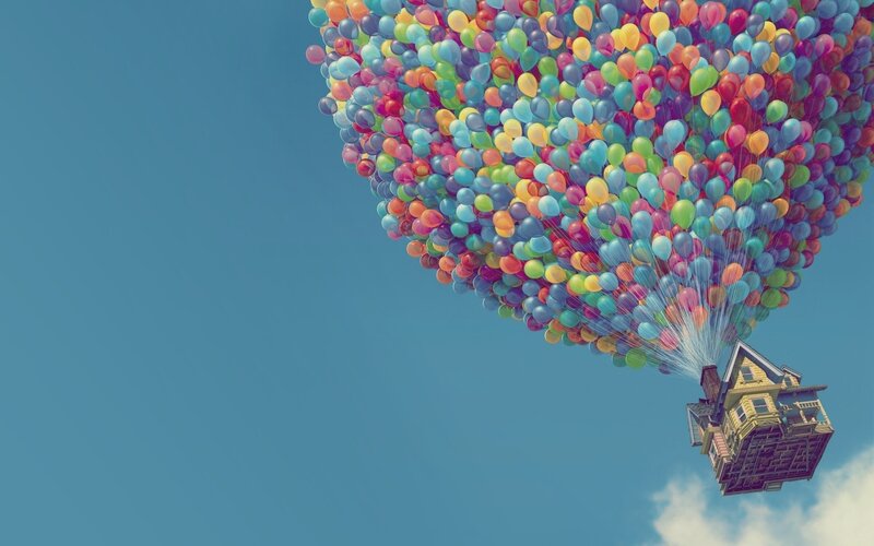 house lifted by balloons