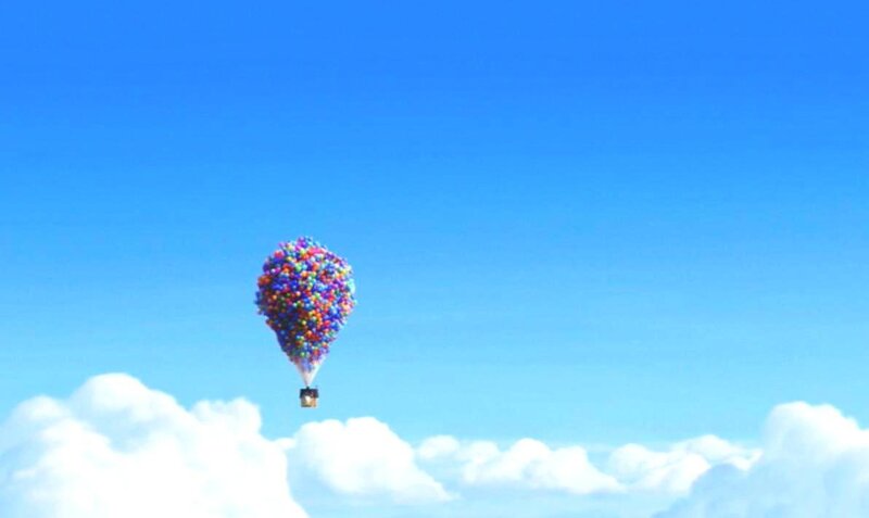 house lifted by balloons