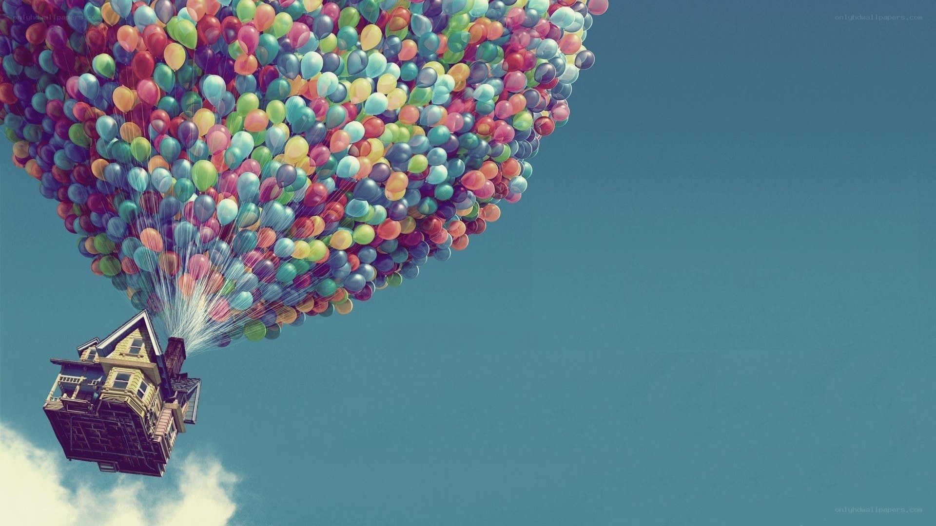 house lifted by balloons