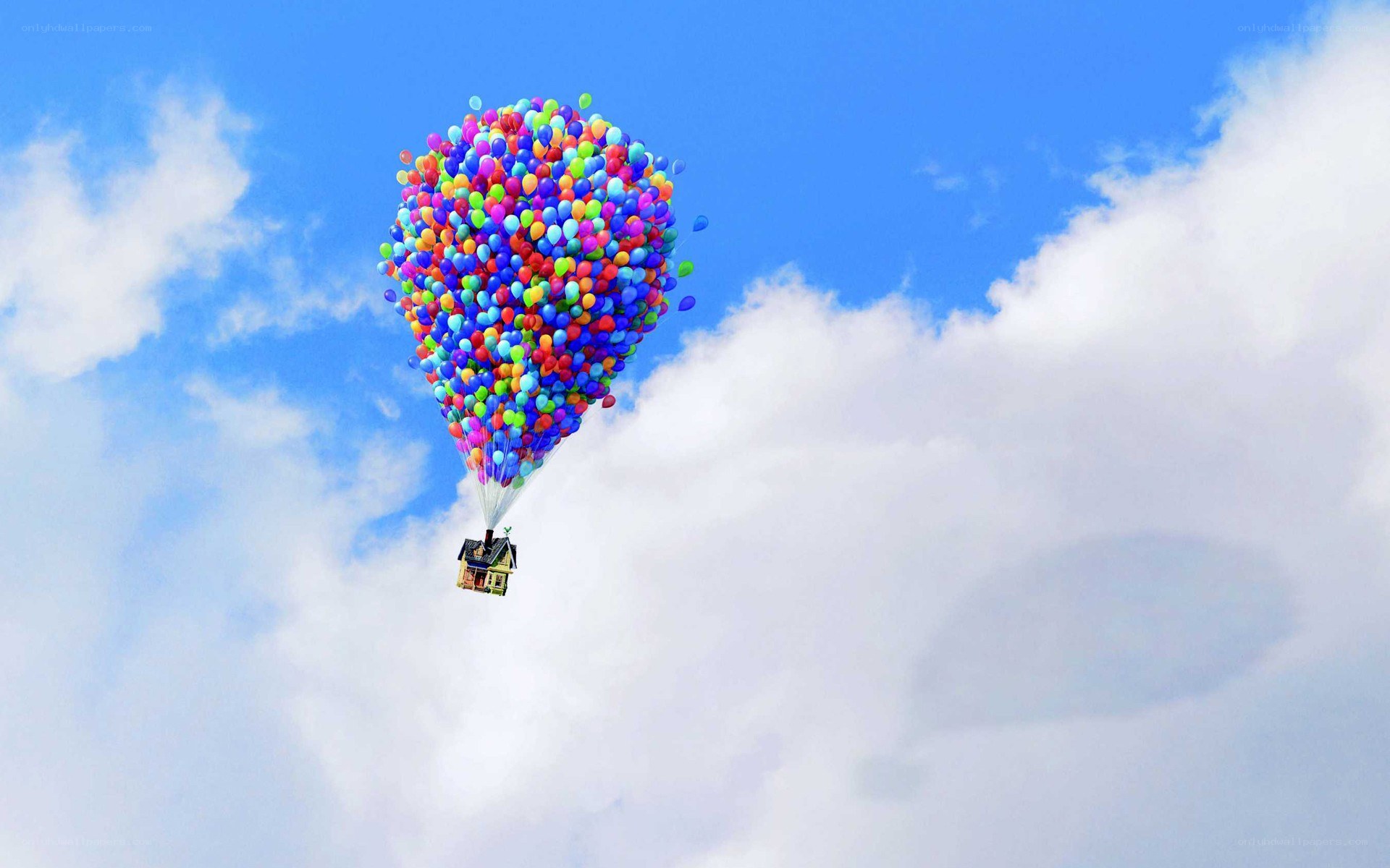 house lifted by balloons