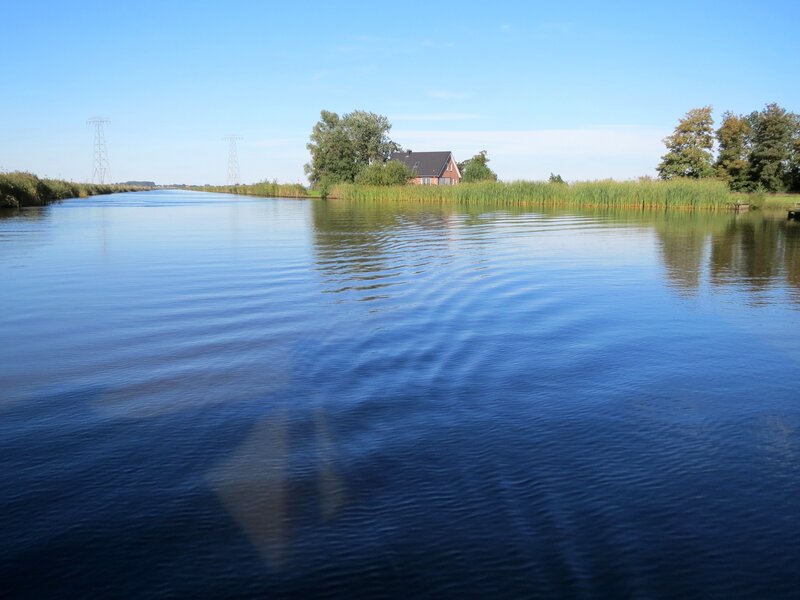 House on Riverbank — Blue