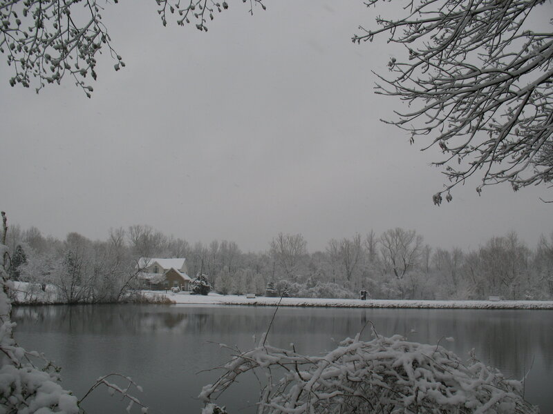 House on Snowy Lake Shore