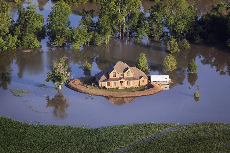 House surrounded by floodwaters