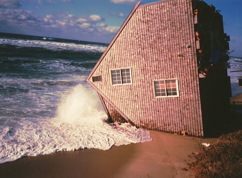 House tilted by ocean wave
