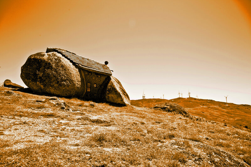 House under a boulder