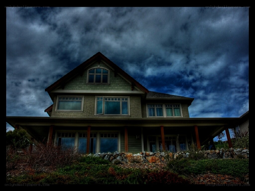 House under stormy sky