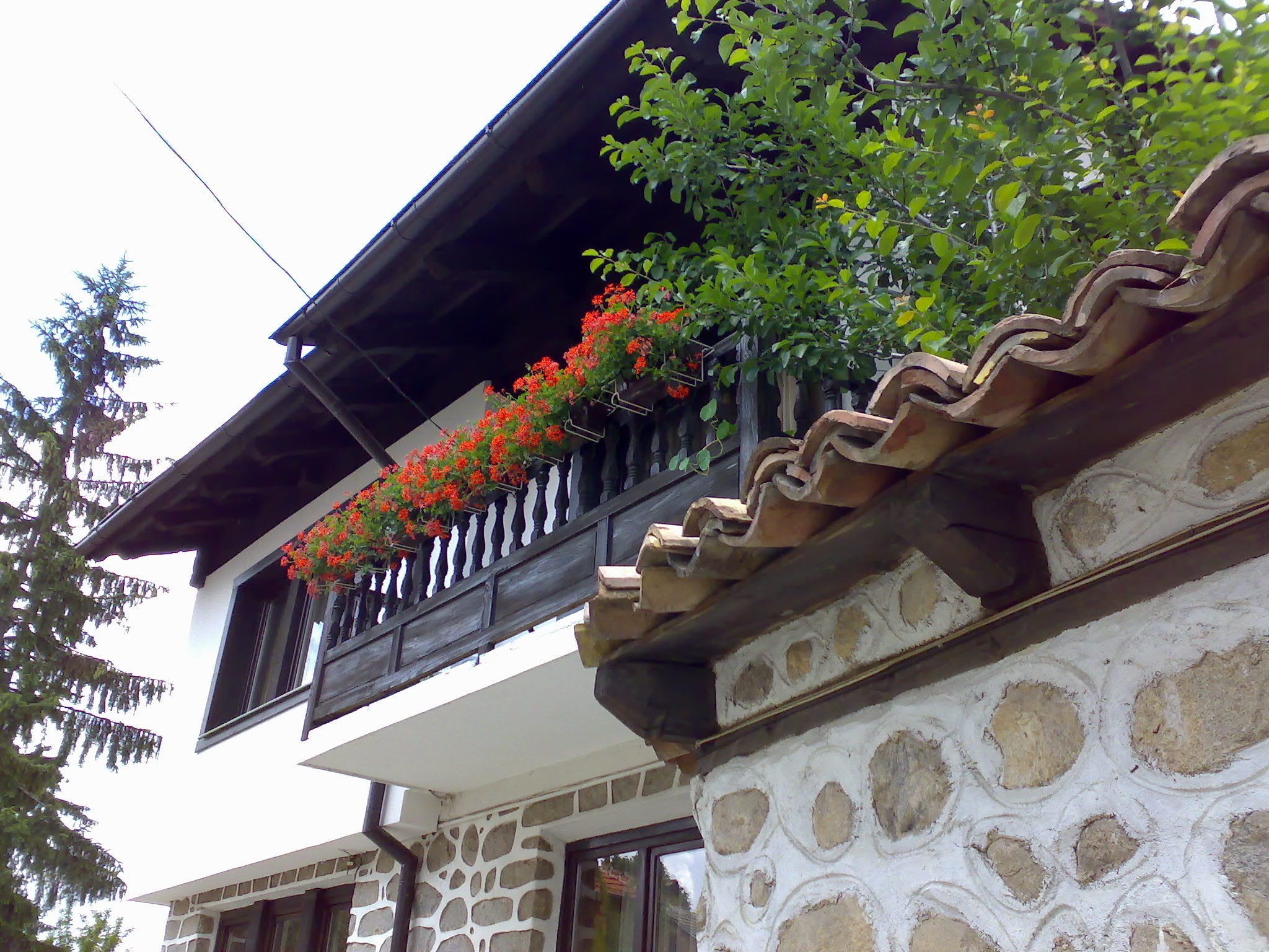 House with balcony and flowers
