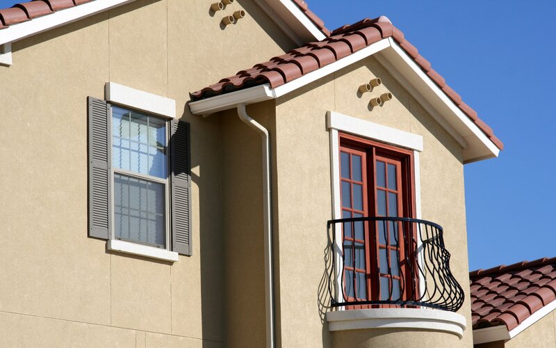 House with balcony and shutters
