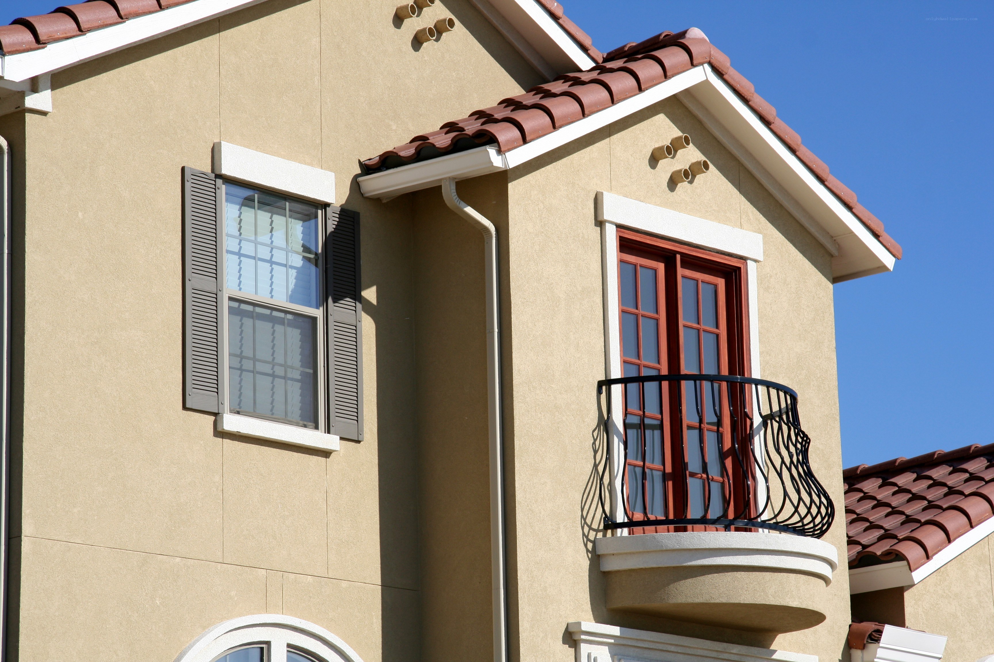 House with balcony and shutters