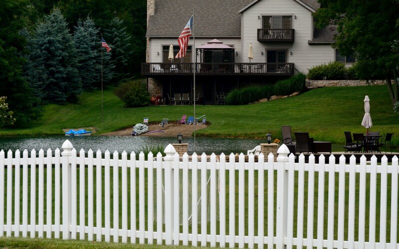 House with Lake and Fence