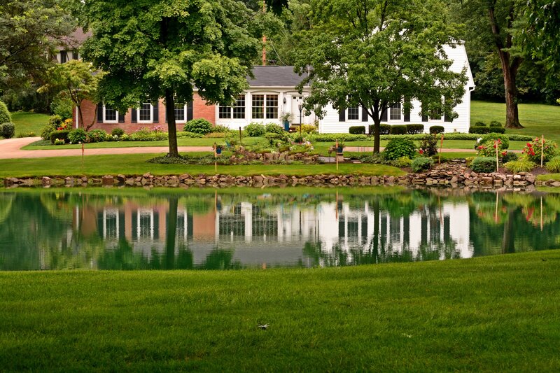 House with Pond Reflection
