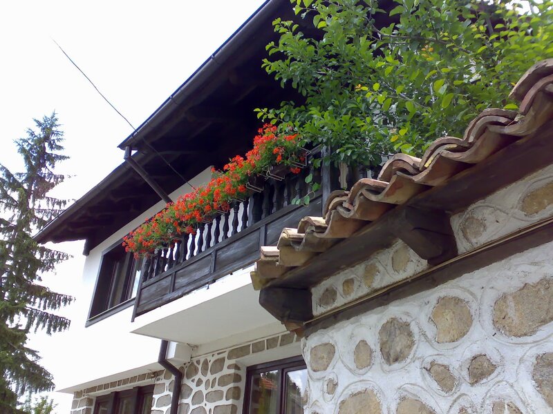 House with stone walls and balcony