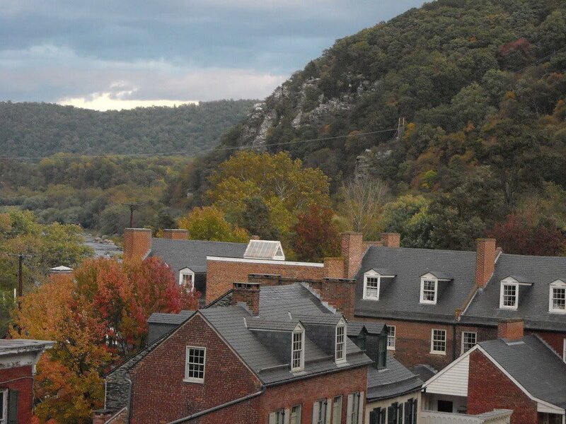 Houses in a valley with autumn trees