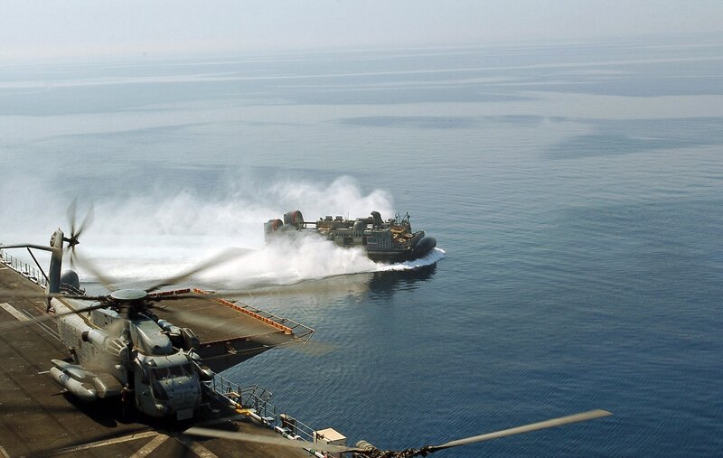 Hovercraft Near Aircraft Carrier