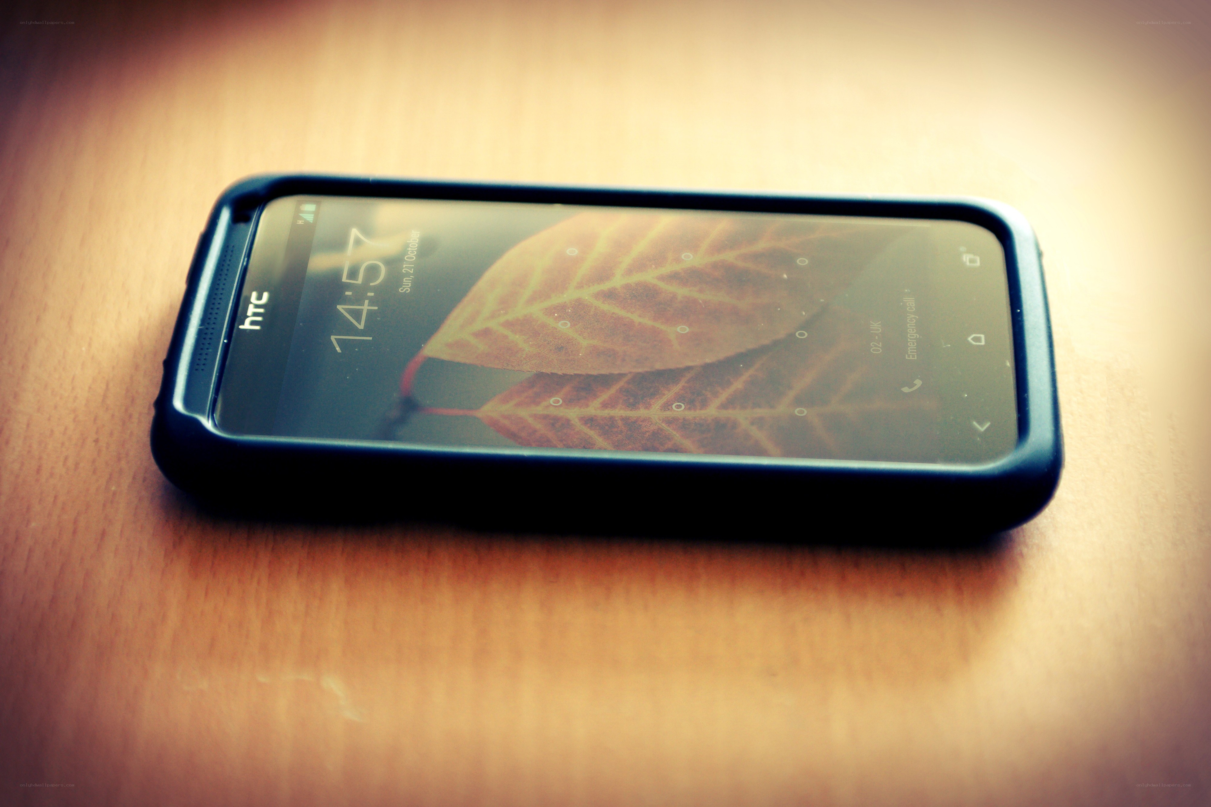 HTC phone on wooden table