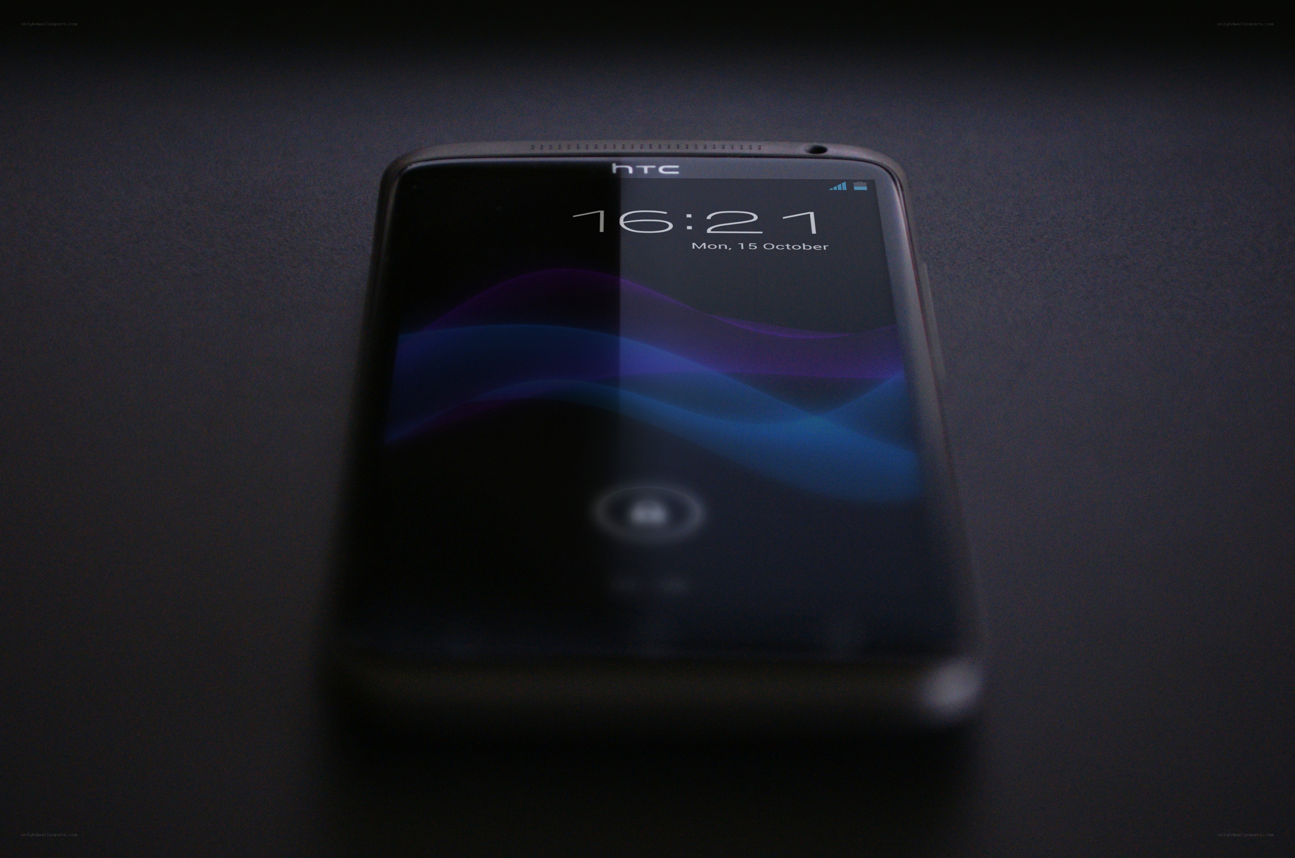 HTC smartphone on dark surface