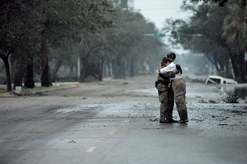 Hug after hurricane damage