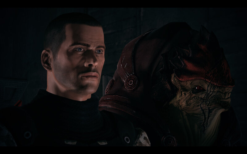 human and alien characters in dark setting
