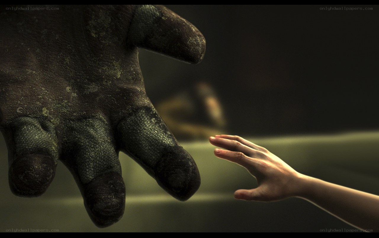 Human hand reaching for a monster's hand