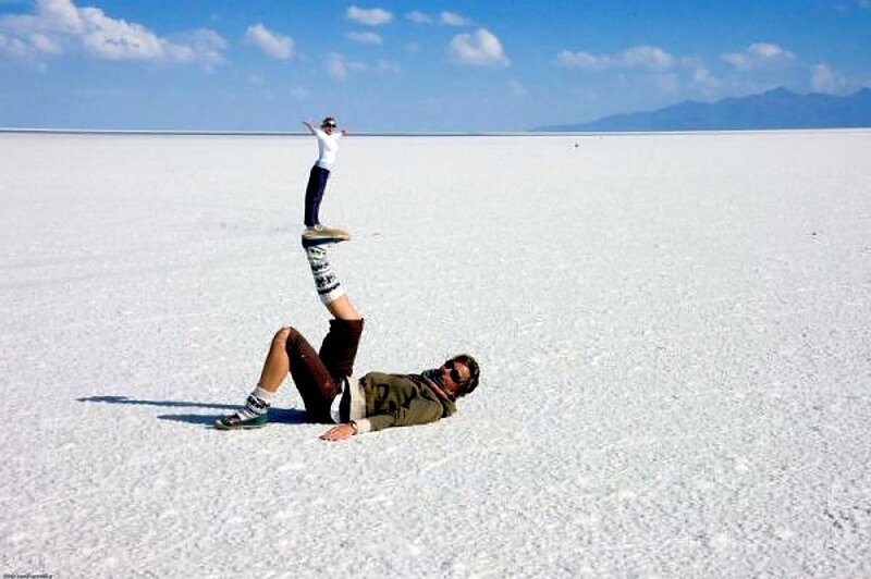 Human pyramid on salt flats