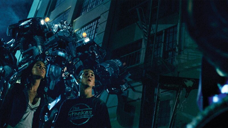Humans facing giant robot