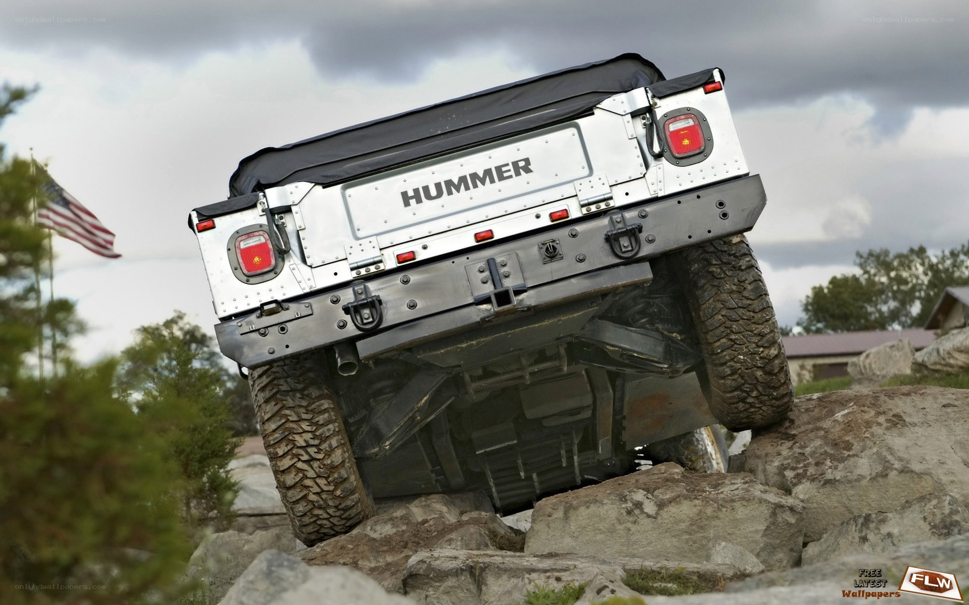 Hummer climbing rocky terrain