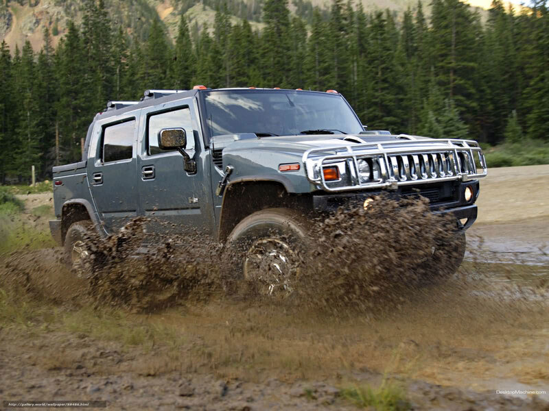 Hummer driving through mud