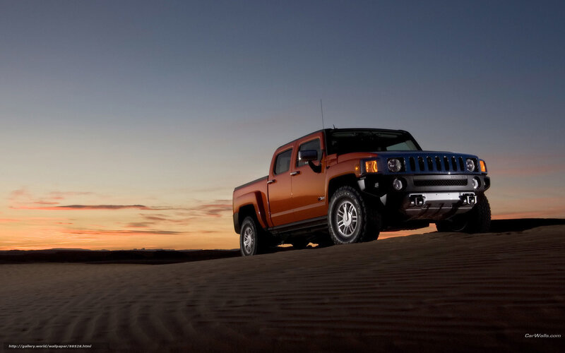 Hummer H3 in desert at sunset