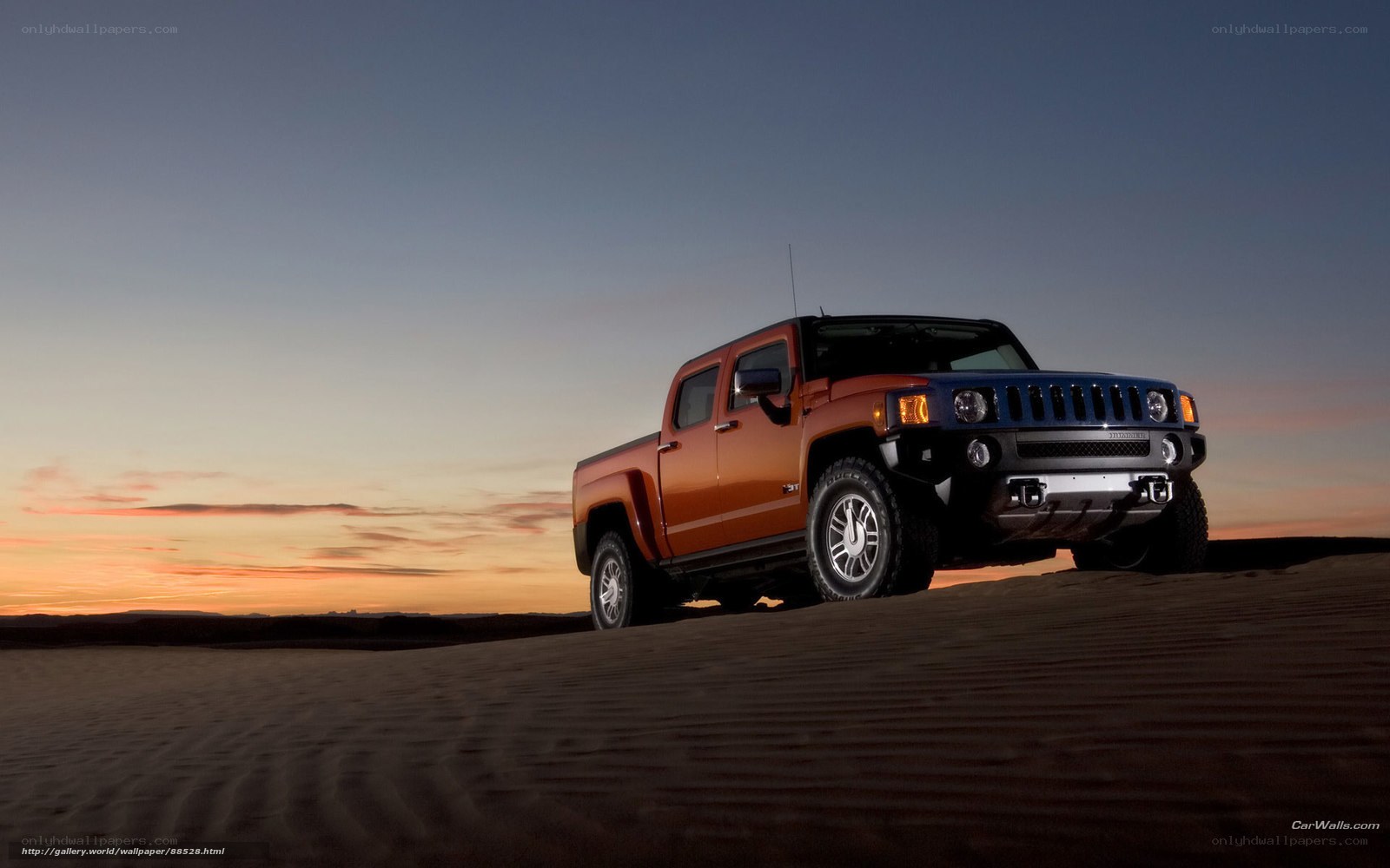 Hummer H3 in desert at sunset
