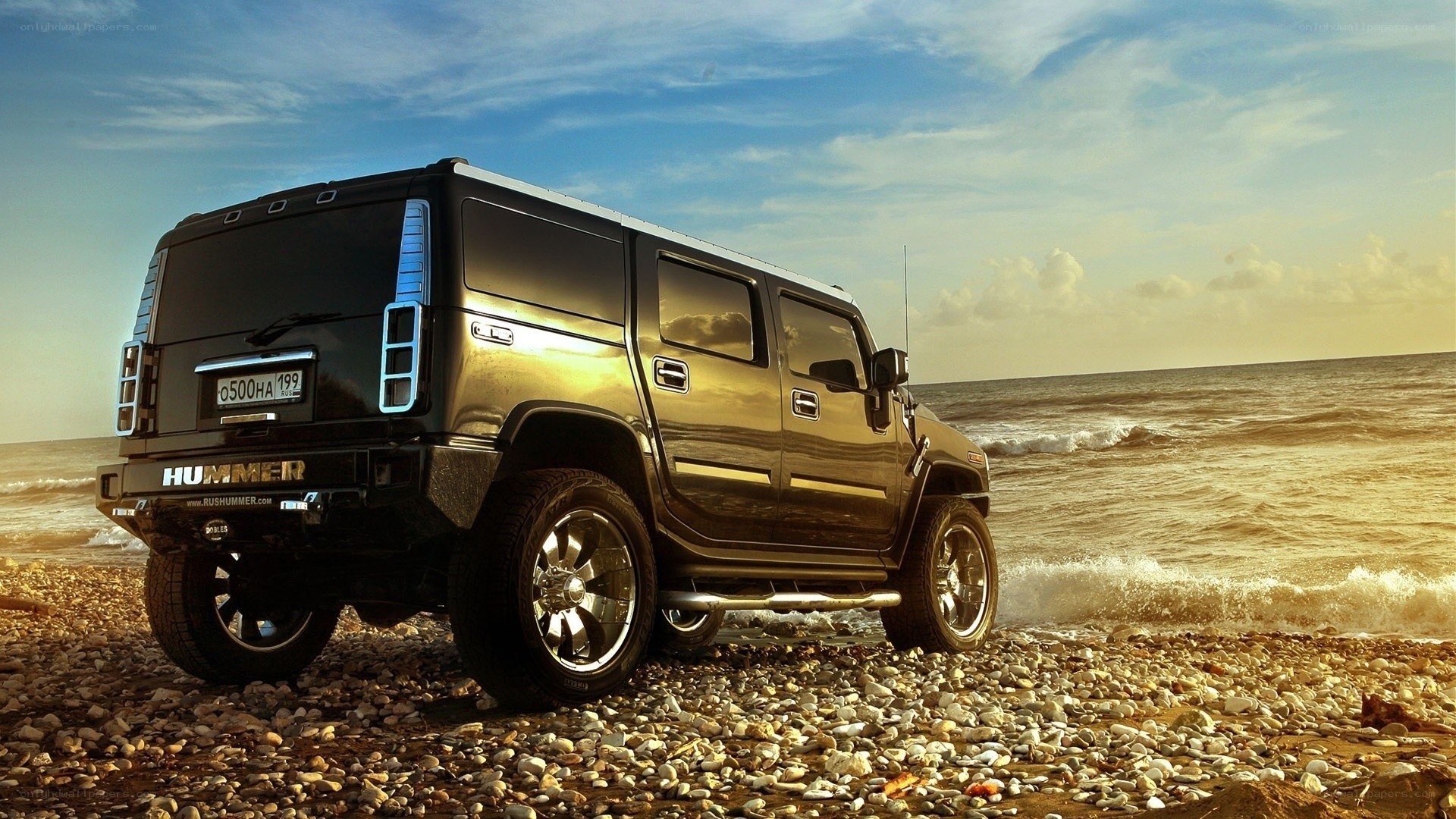 Hummer on a pebble beach