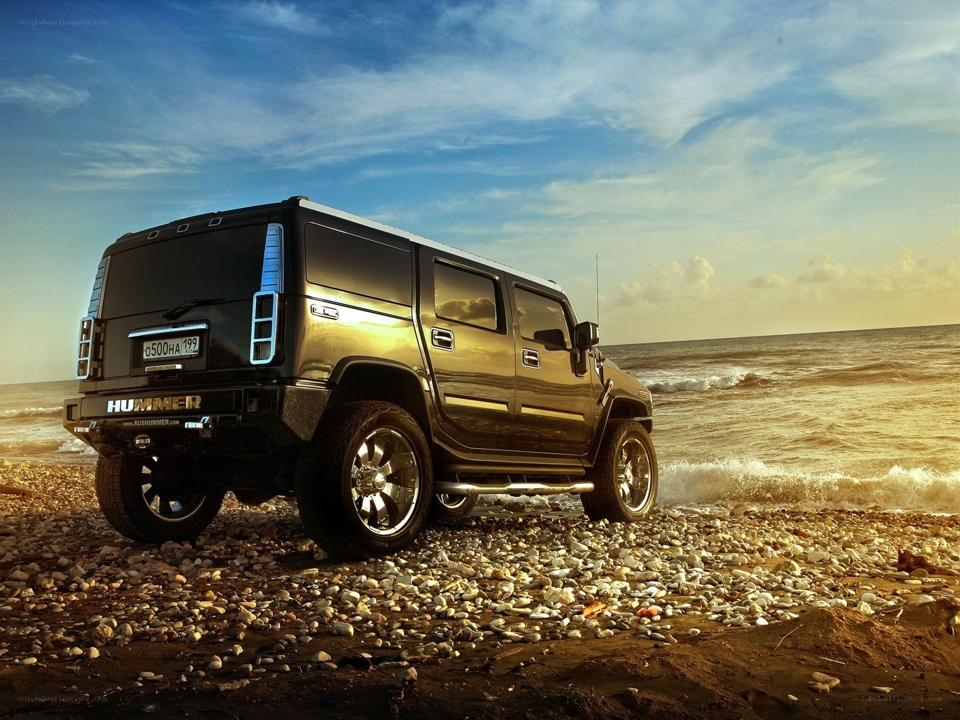 Hummer on a pebble beach