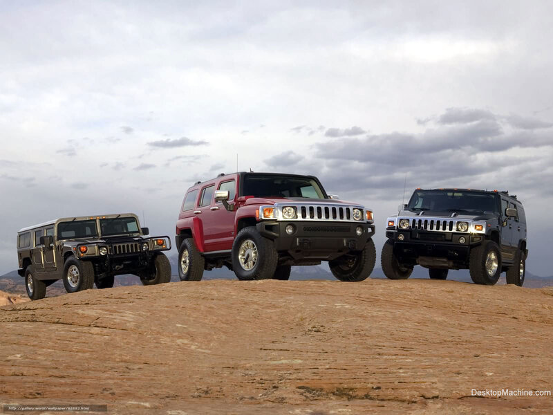 Hummer SUVs on a rocky hill