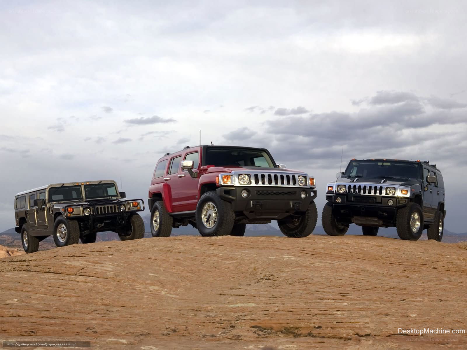 Hummer SUVs on a rocky hill